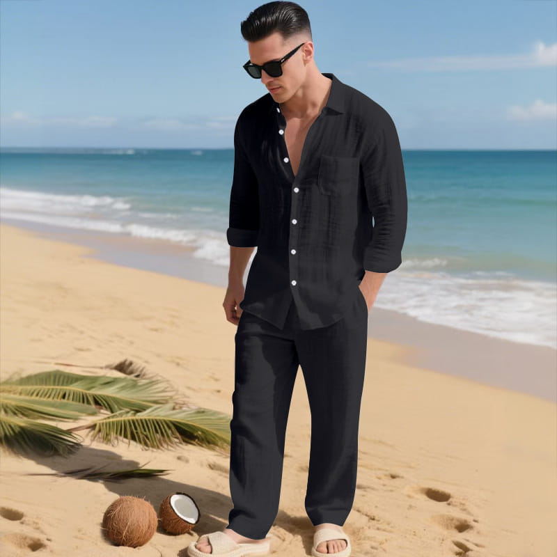 Black linen men long sleeve button-down shirt with rolled sleeves and chest pocket from a pants set.