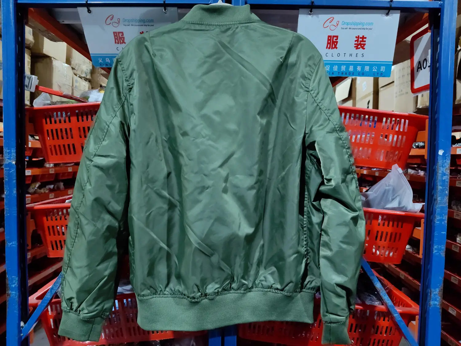 olive green nylon ma1 pilot bomber jacket with ribbed cuffs and hem and a casual stand collar.