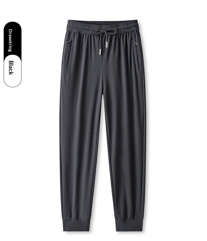 Black ice silk antibacterial casual sweatpants featuring smooth stretchy fabric drawstring and elastic cuffs.