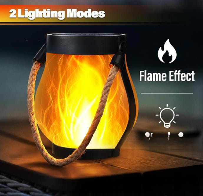 A black metal flickering flame garden lamp with a rope handle and two lighting modes for outdoor use.