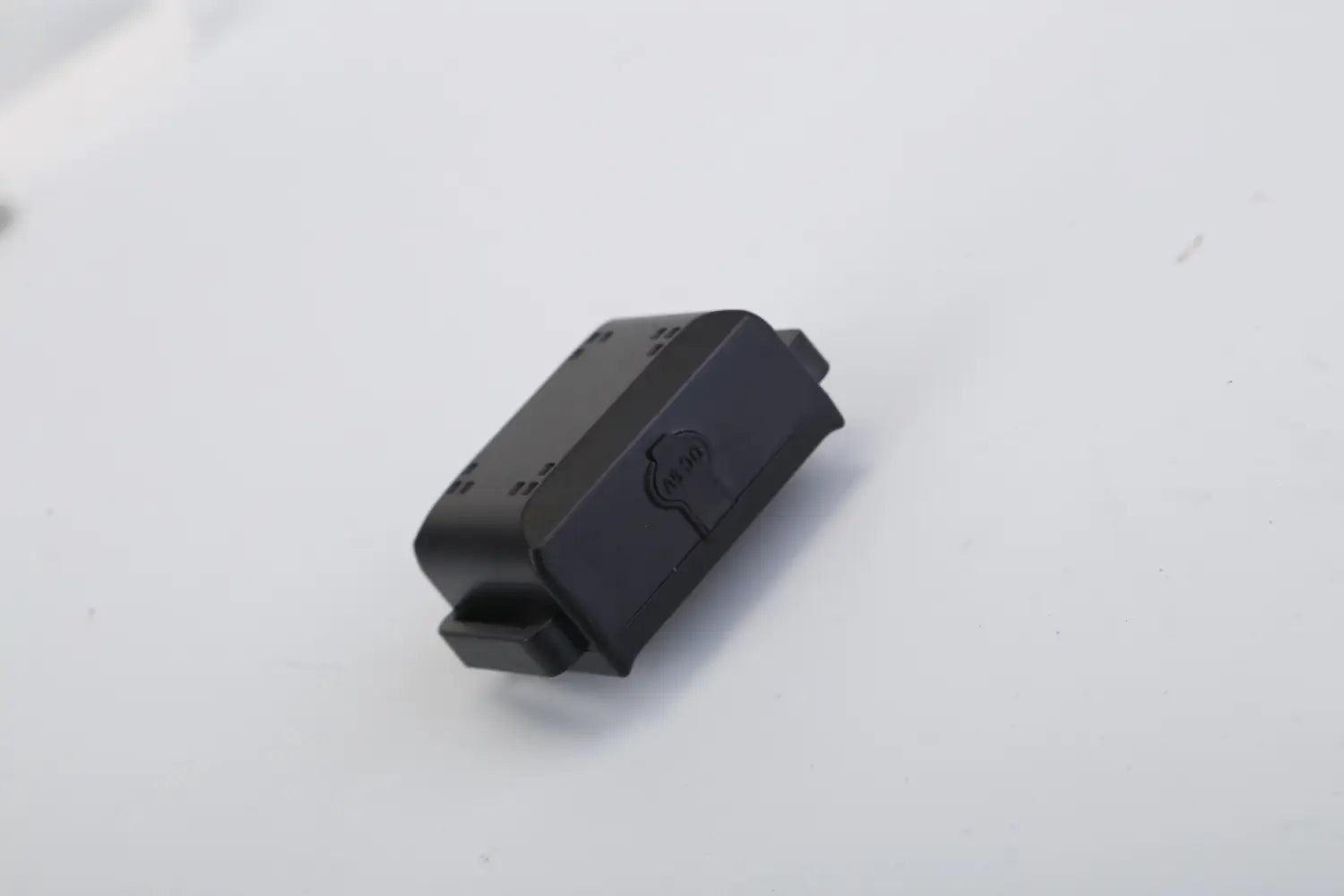 Black plastic car key fob with a rectangular textured body for the dog training collar 3280ft waterproof shock system.