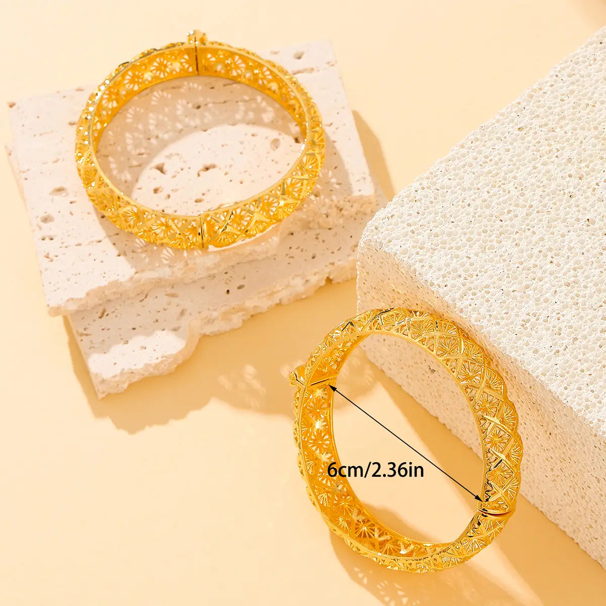 vintage 18k gold plated filigree four leaf clover bangle bracelets featuring golden intricate patterned designs.