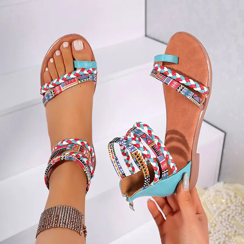 Bohemian ethnic braided ankle strap flat sandals featuring turquoise and multicolored patterned braided straps.