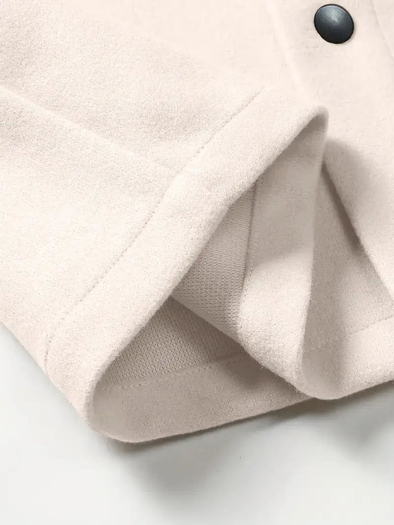 Men’s classic slim fit wool blend lapel jacket in soft blush pink with a black button and neatly stitched cuffs.
