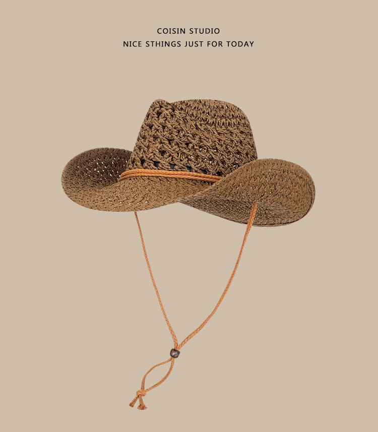 A woven straw cowboy hat for men in brown with a tan leather band and matching adjustable chin strap.
