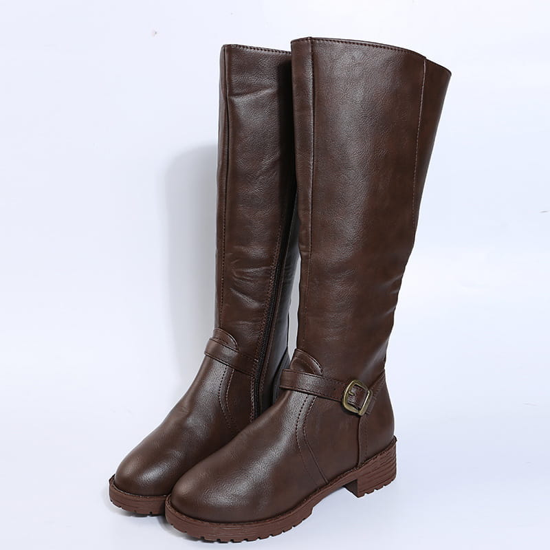 Leather knee high knight boots in brown with a buckle strap and chunky sole made of leather.