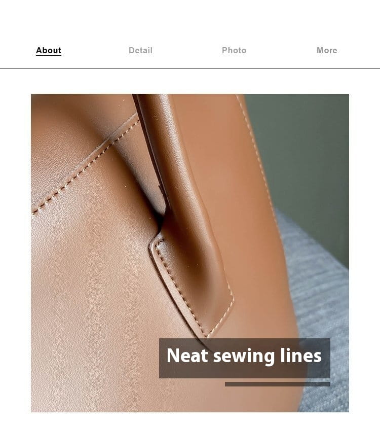 Vintage structured leather tote bag in tan with neat precise stitching along its seams and top handles