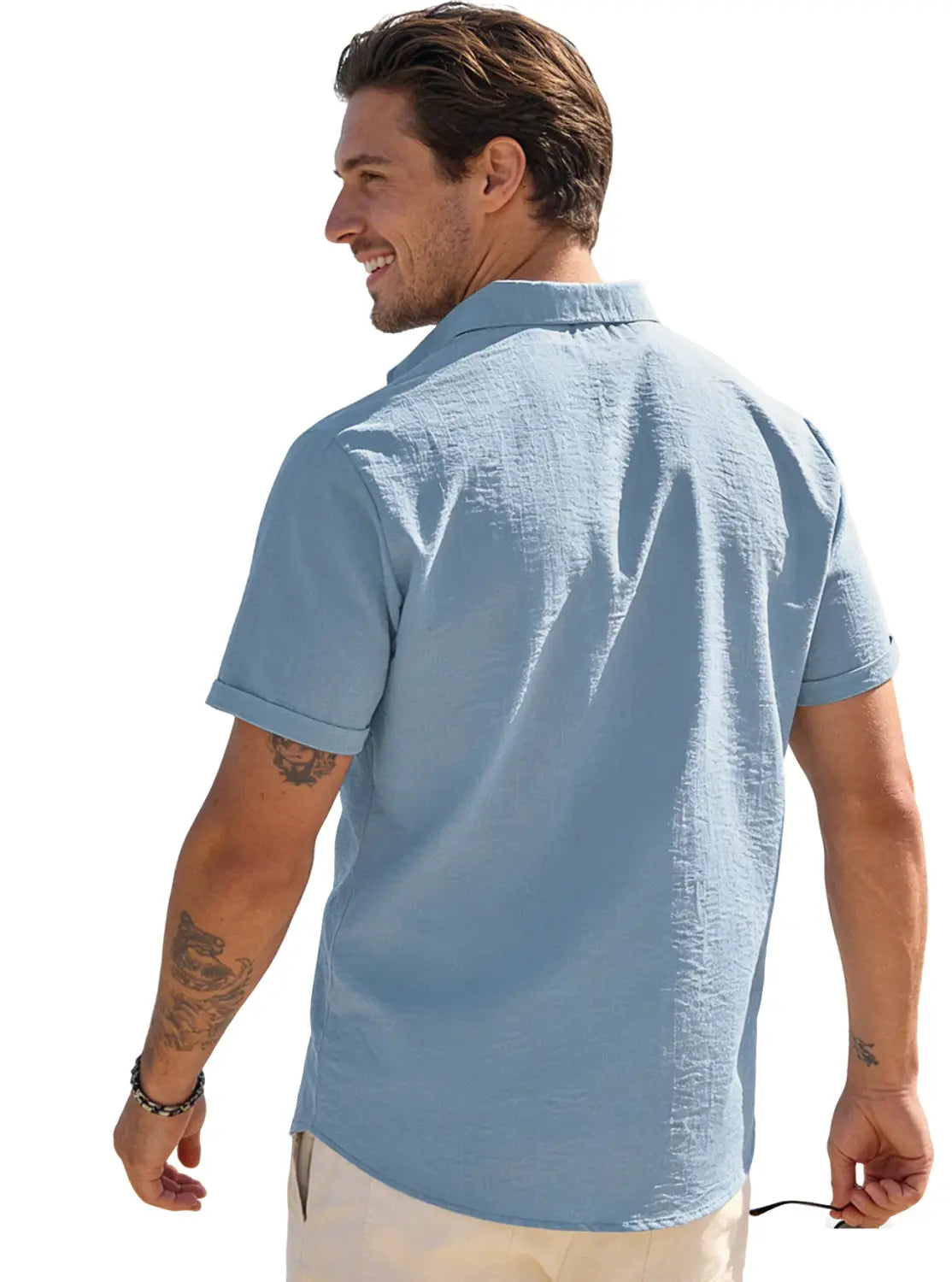 Light blue men’s textured bamboo linen short sleeve button down shirt with a collar and textured fabric.