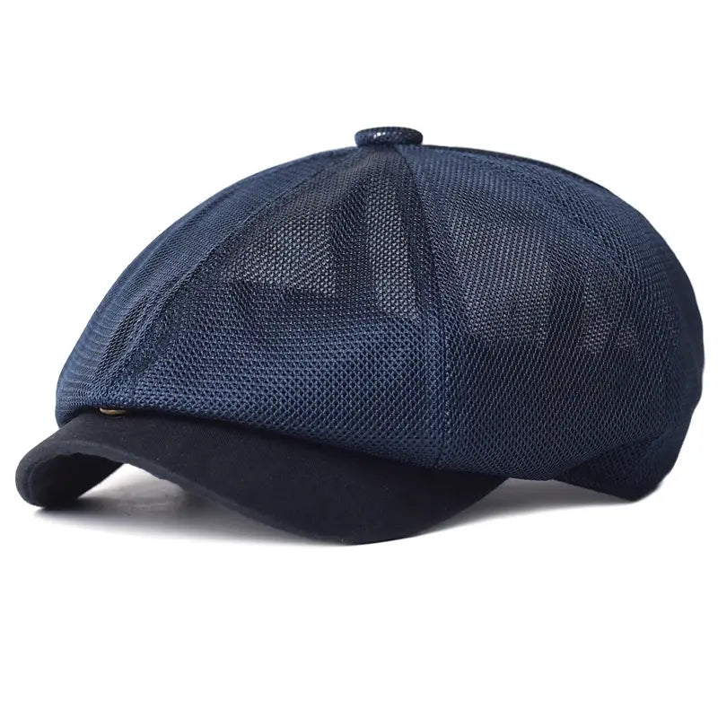 Navy blue mesh newsboy cap with a solid fabric brim designed as a breathable summer flat cap for men and women.