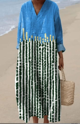 Women’s abstract v neck patterned maxi dress featuring a flowing blue and green striped design with long sleeves rolled at the cuffs and vertical dark green dotted stripes on an off-white background.