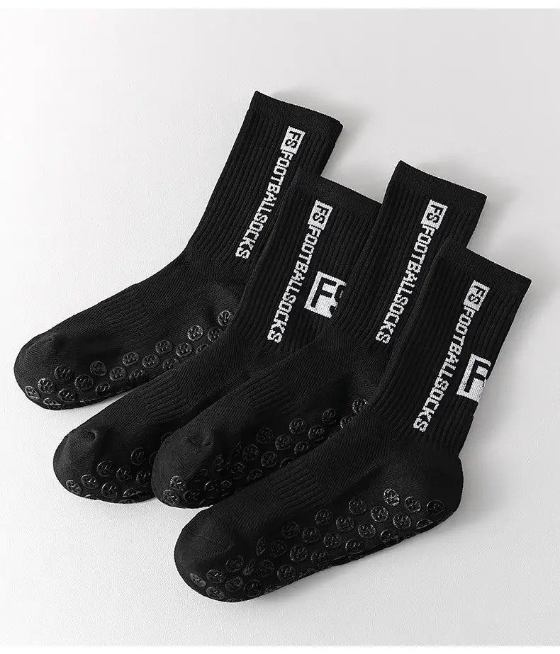Black anti-slip football grip socks for men featuring white f8 branding and a textured non-slip sole.