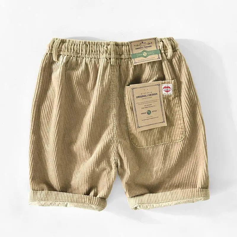 Men’s premium beige ribbed corduroy drawstring shorts with a relaxed fit and rolled cuffs.