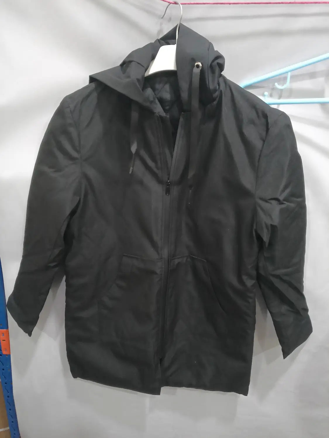 Men thick hooded winter jacket in black hooded raincoat style with full-length zipper and two front pockets.