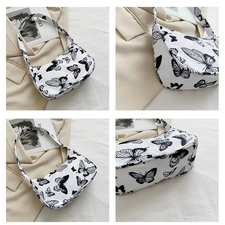 Sac sous-bras en nylon blanc, avec un imprimé papillon noir, des accents à imprimé léopard et à carreaux.