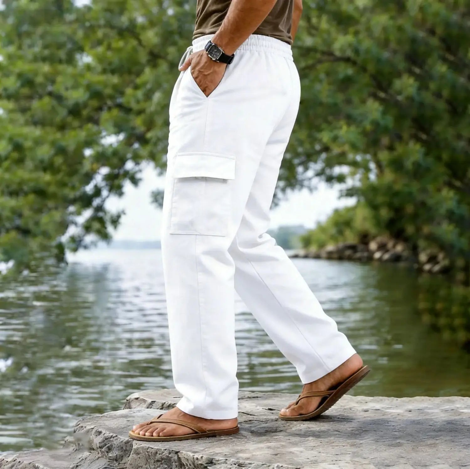 Men cotton linen cargo pants in white with a relaxed fit, large side pockets, and a casual straight leg drawstring design made from lightweight fabric.