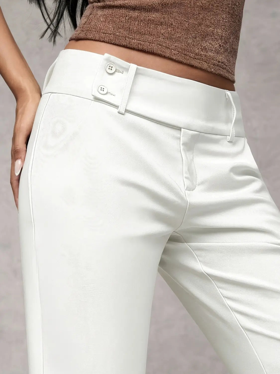 white high-waisted wide leg work pants made of sleek satin-like material with double-button closure suitable for casual wear