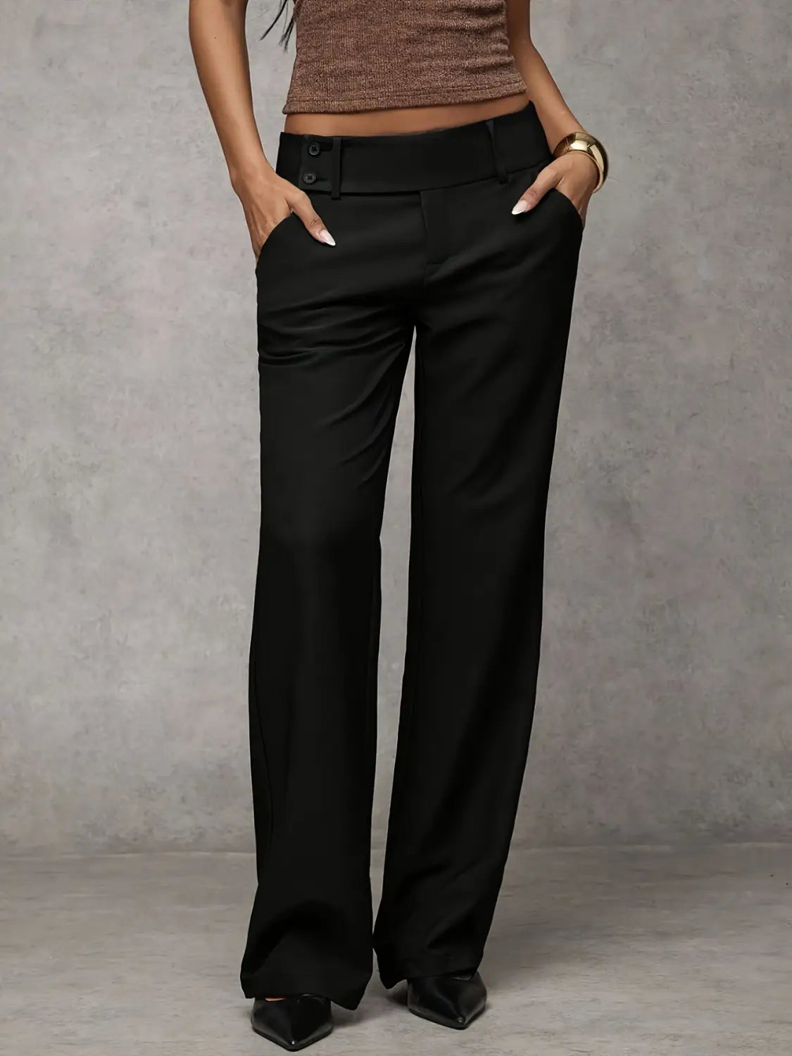 black wide-leg work pants with a high waist and buttoned belt designed for casual wear