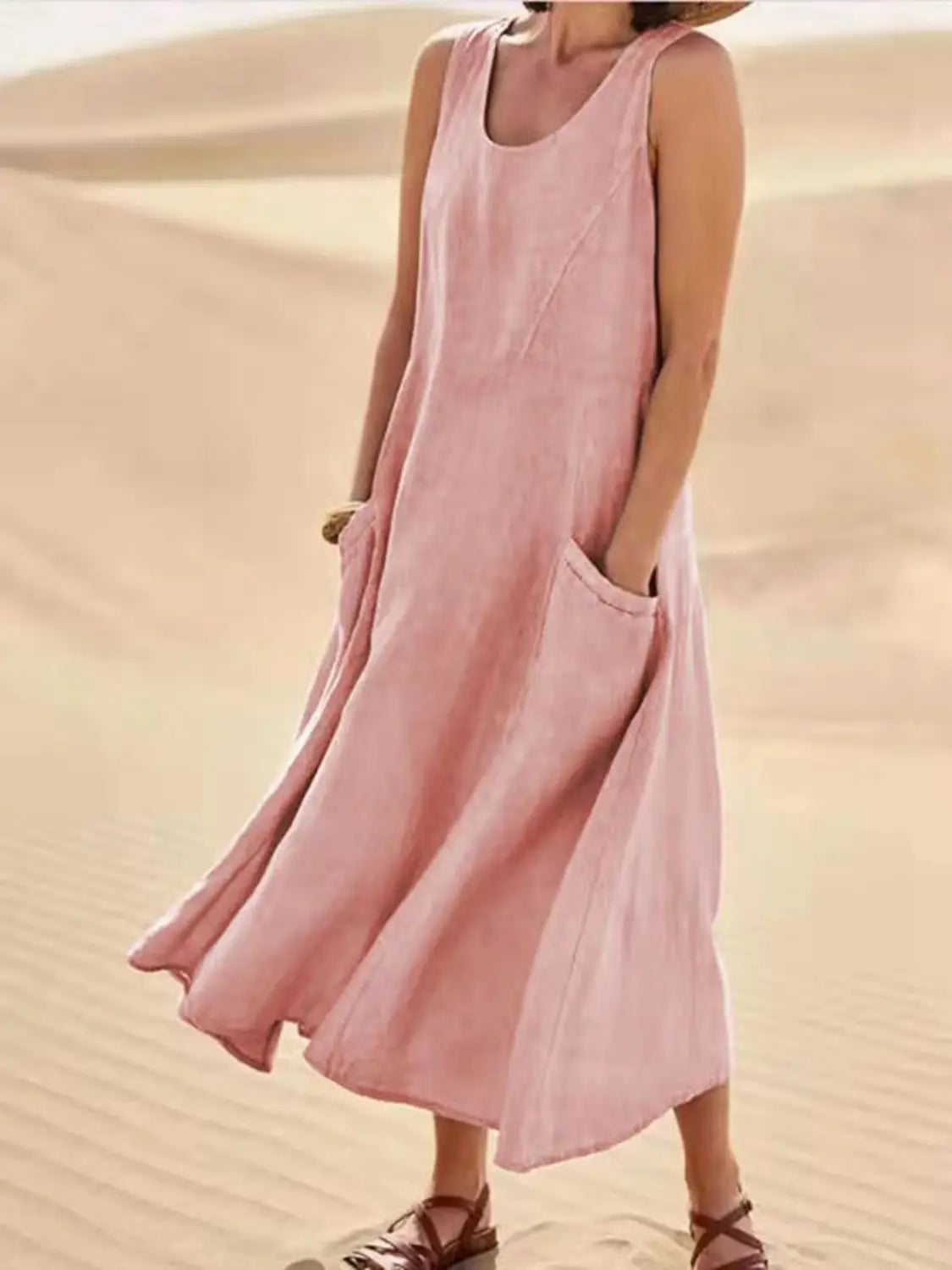 Robe longue maxi en lin rose sans manches, fluide, coupe trapèze en A, avec une coupe ample et de grandes poches latérales.