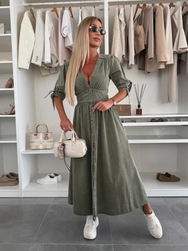 Olive green button front denim midi dress with puff sleeves featuring rolled sleeves and a cinched waist.