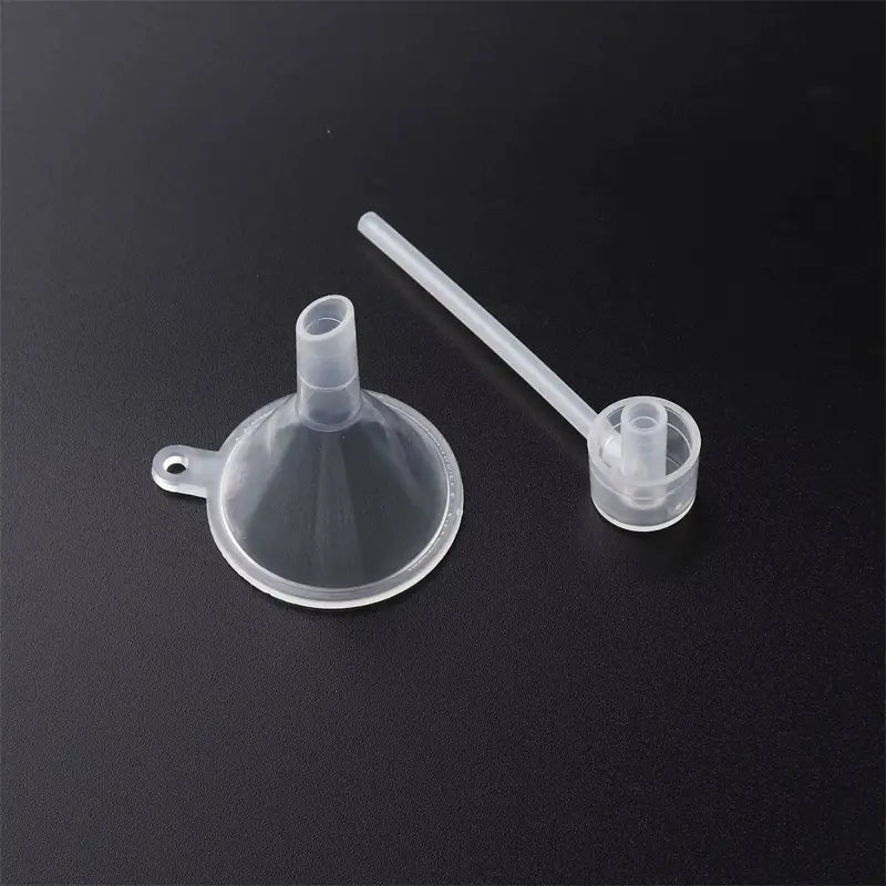 clear plastic mini funnel with small handle and matching clear plastic measuring spoon from essential oil dispenser tool set 3pcs for precise liquid transfer