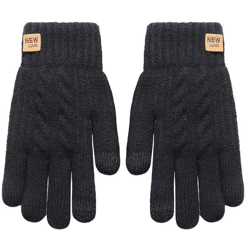 Thermal touchscreen winter gloves for women in dark gray knitted material with a cable-knit pattern and tan new jund brand tags on the wrist shown from the back side.