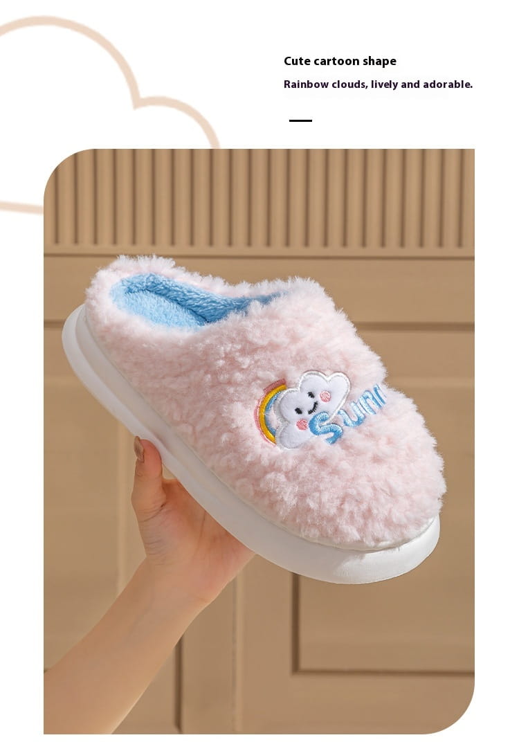 Pink fluffy slipper with a rainbow cloud design and light blue inner lining made of plush cotton from the smiling cloud and rainbow plush cotton slippers collection.