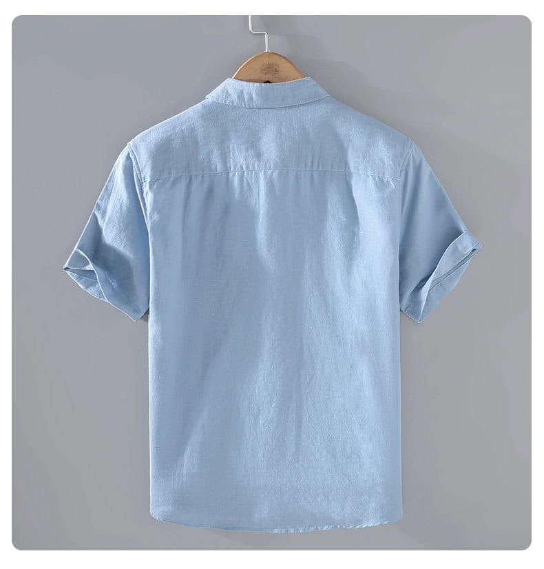 Light blue men linen mandarin collar short sleeve shirt with a subtle textured fabric and button-up front.