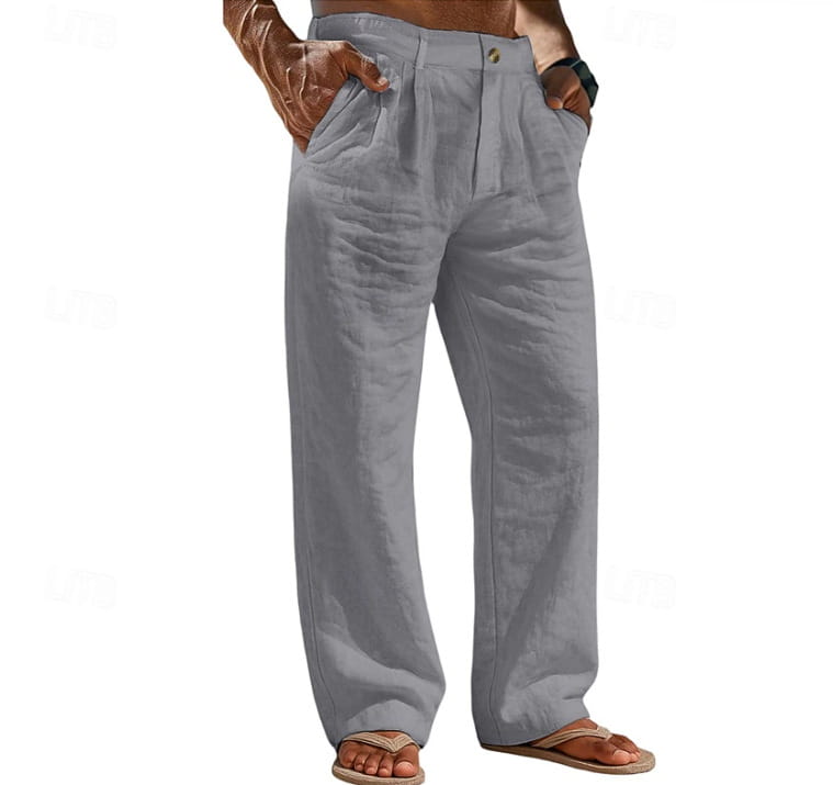 Pantalones de algodón y lino de ajuste relajado para hombre en color gris, con corte recto relajado y pliegues visibles en la cintura.