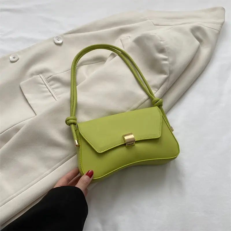 A minimalist faux leather structured shoulder bag in vibrant lime green featuring a sleek design with gold-tone hardware.