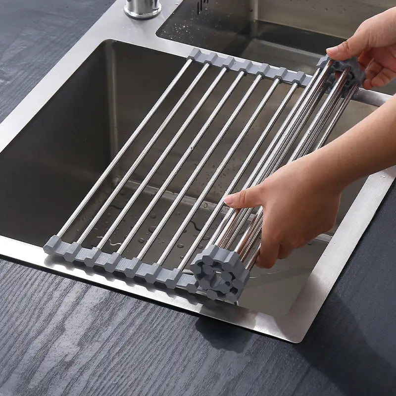 Gray and stainless steel collapsible dish rack with a sleek modern design for drying dishes over the sink