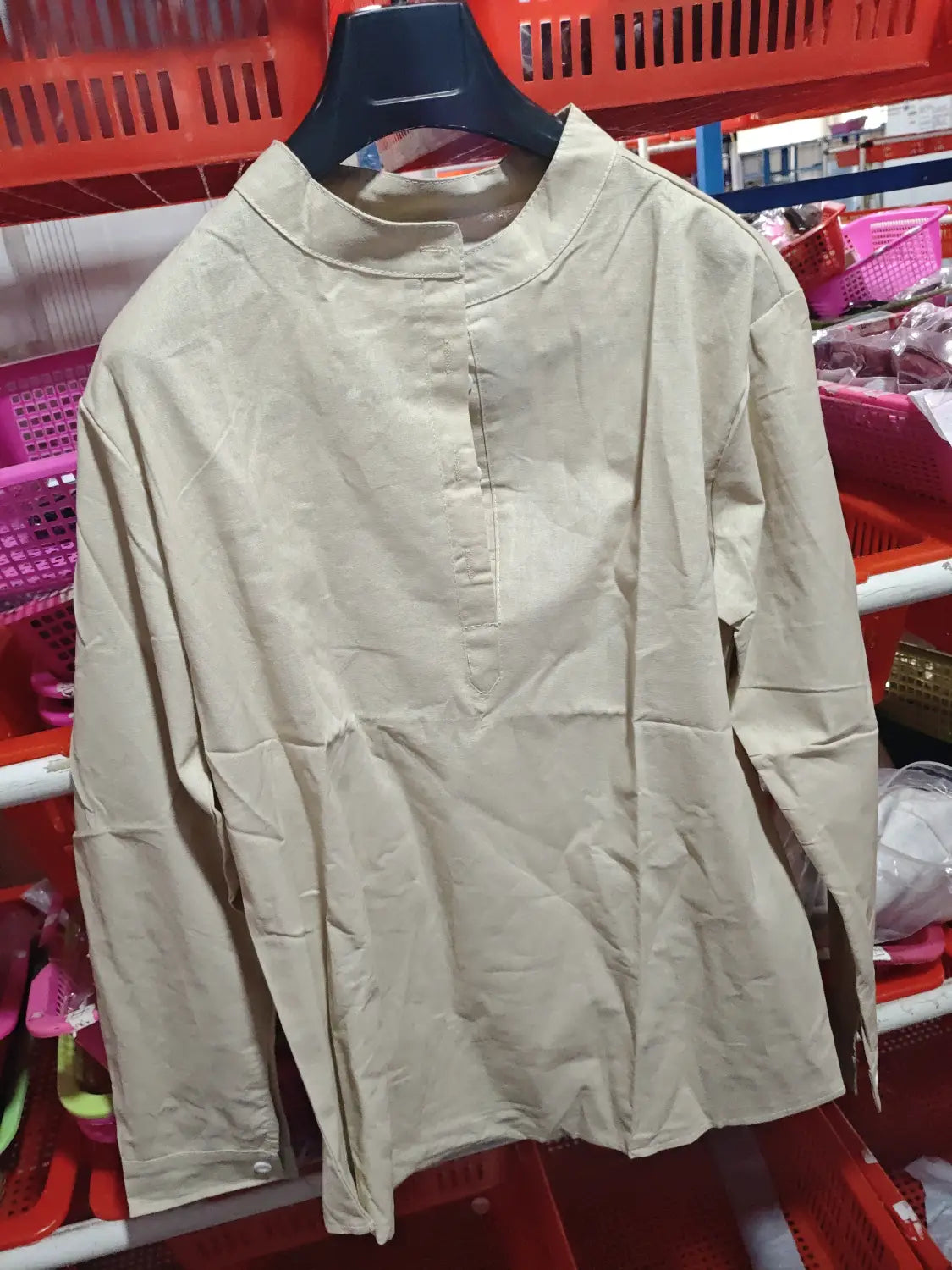 Beige loose linen blend breathable long sleeve sports shirt with stand-up collar and button-front closure.