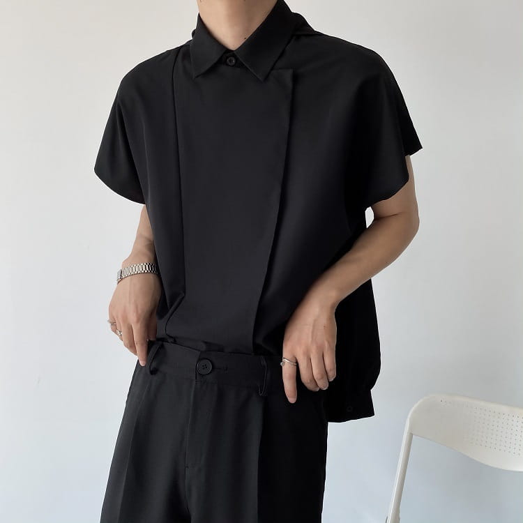 Men oversized long sleeve button up shirt in black with a modern minimalist design and short sleeves.