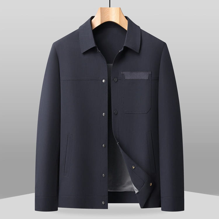 Black men’s lapel utility jacket with sleek modern design and subtle checkered lining texture.