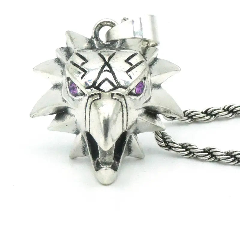 Geometric wild game animal pendant chain necklace featuring a silver wolf head pendant with purple gemstone eyes and spiked mane on a twisted metal chain.
