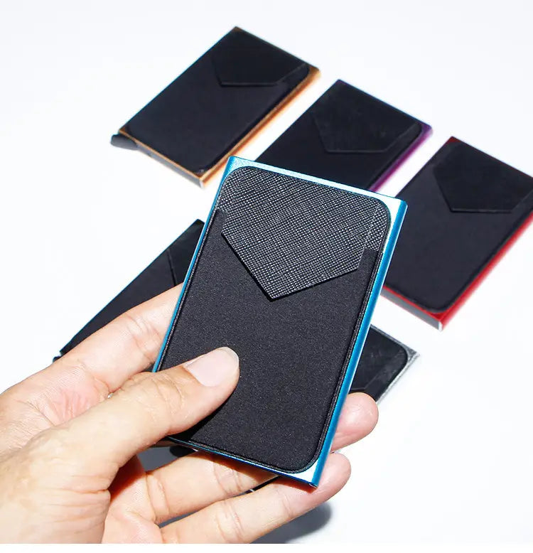 blue metallic-framed minimalist rfid blocking aluminum multi card wallet with black textured interior and flap pocket.