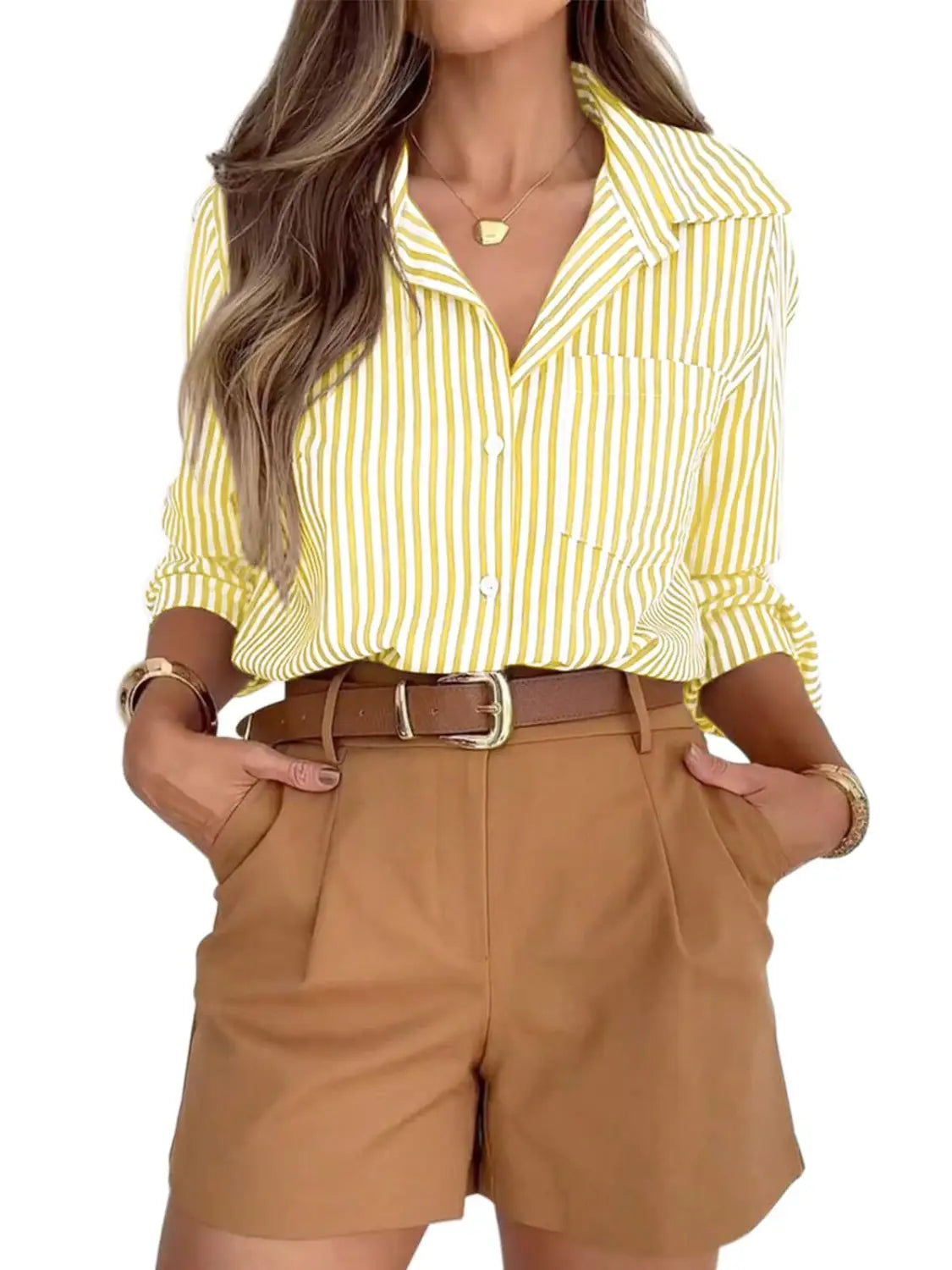 Women’s striped long sleeve button up shirt dress in yellow and white with vertical stripes and rolled sleeves.