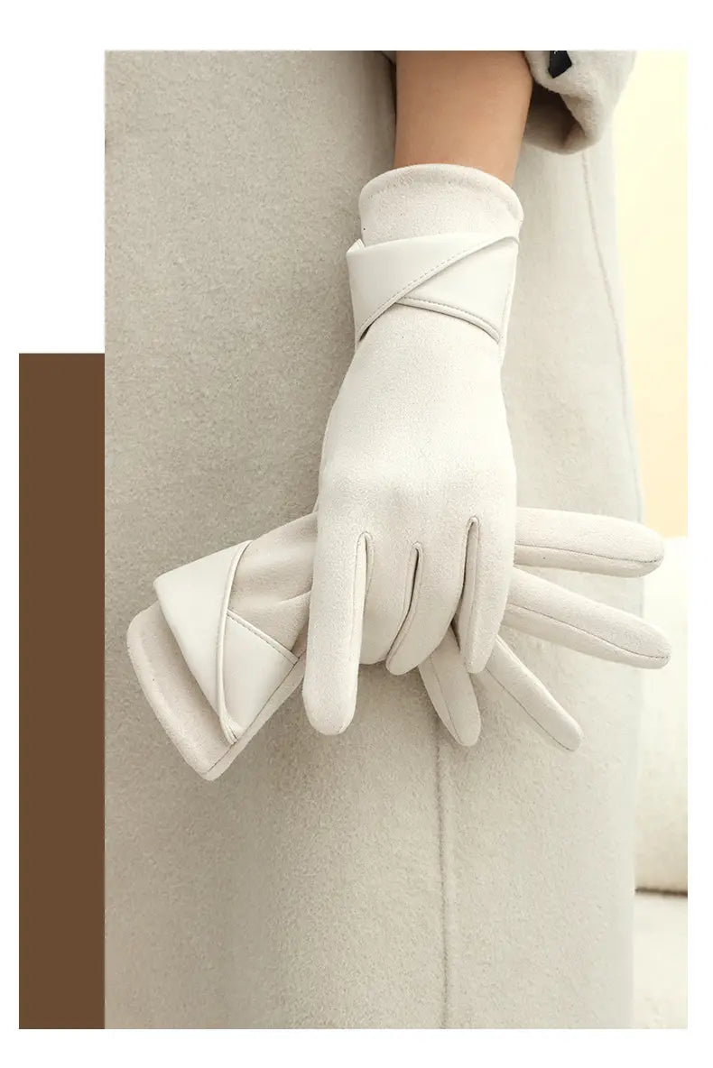White leather touchscreen fleece lined bow gloves with a sleek minimalist design and a wrapped wrist strap shown from the back side.