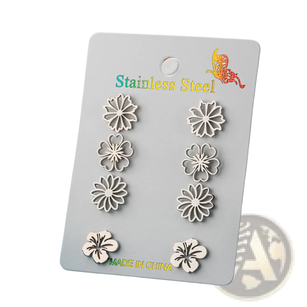 Set of six silver-toned floral stainless steel stud earrings displayed on a card in a 6-piece earring set