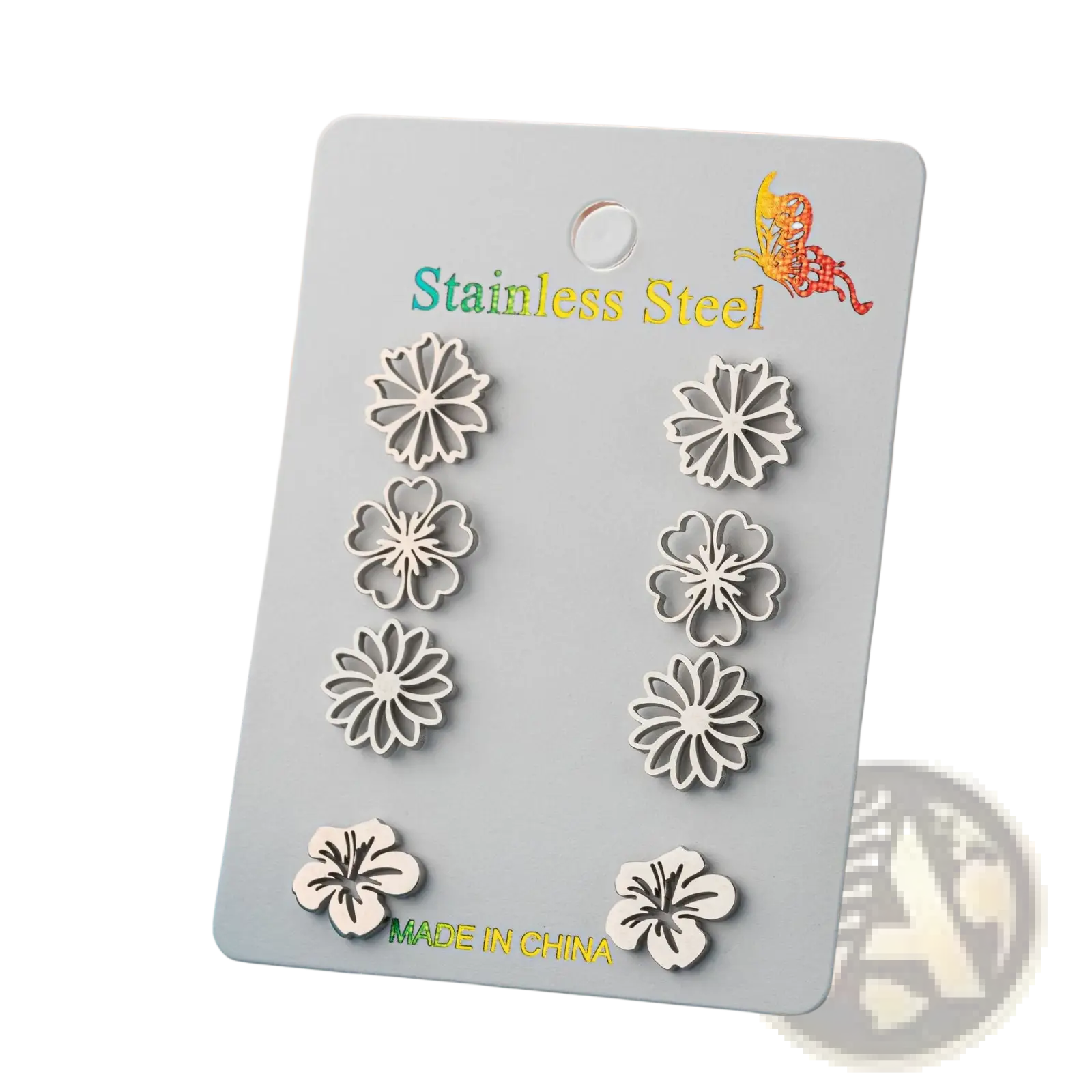 Set of six silver-toned floral stainless steel stud earrings displayed on a card in a 6-piece earring set