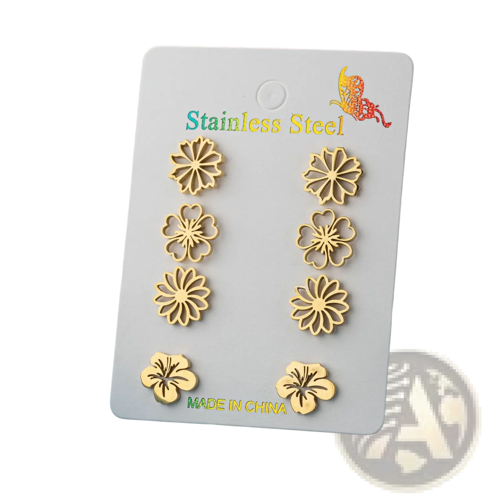Gold-toned stainless steel flower-shaped stud earrings displayed on a white card from a 6-piece floral stud set