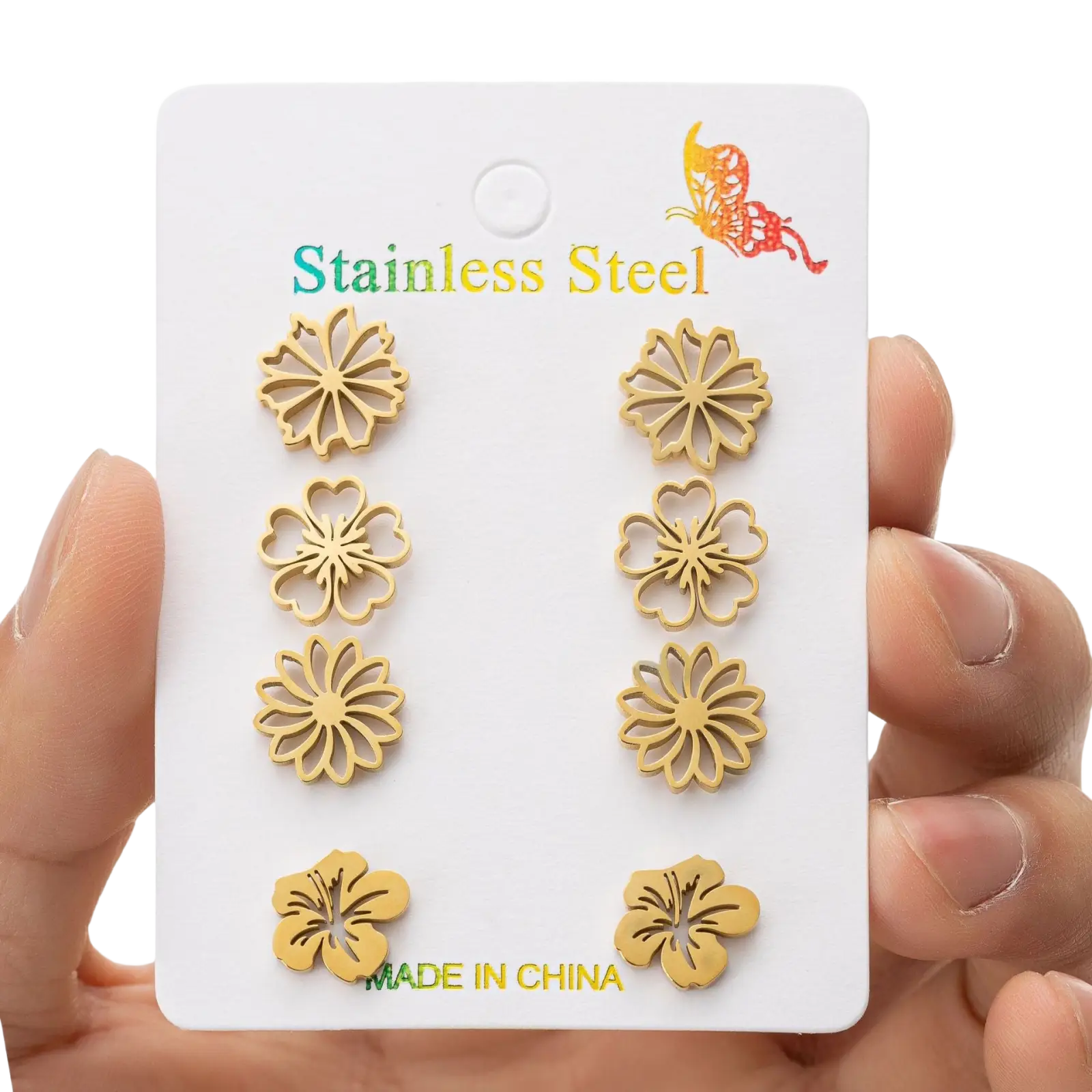 Gold-toned stainless steel flower-shaped stud earrings displayed on a white card from a 6-piece floral earring set