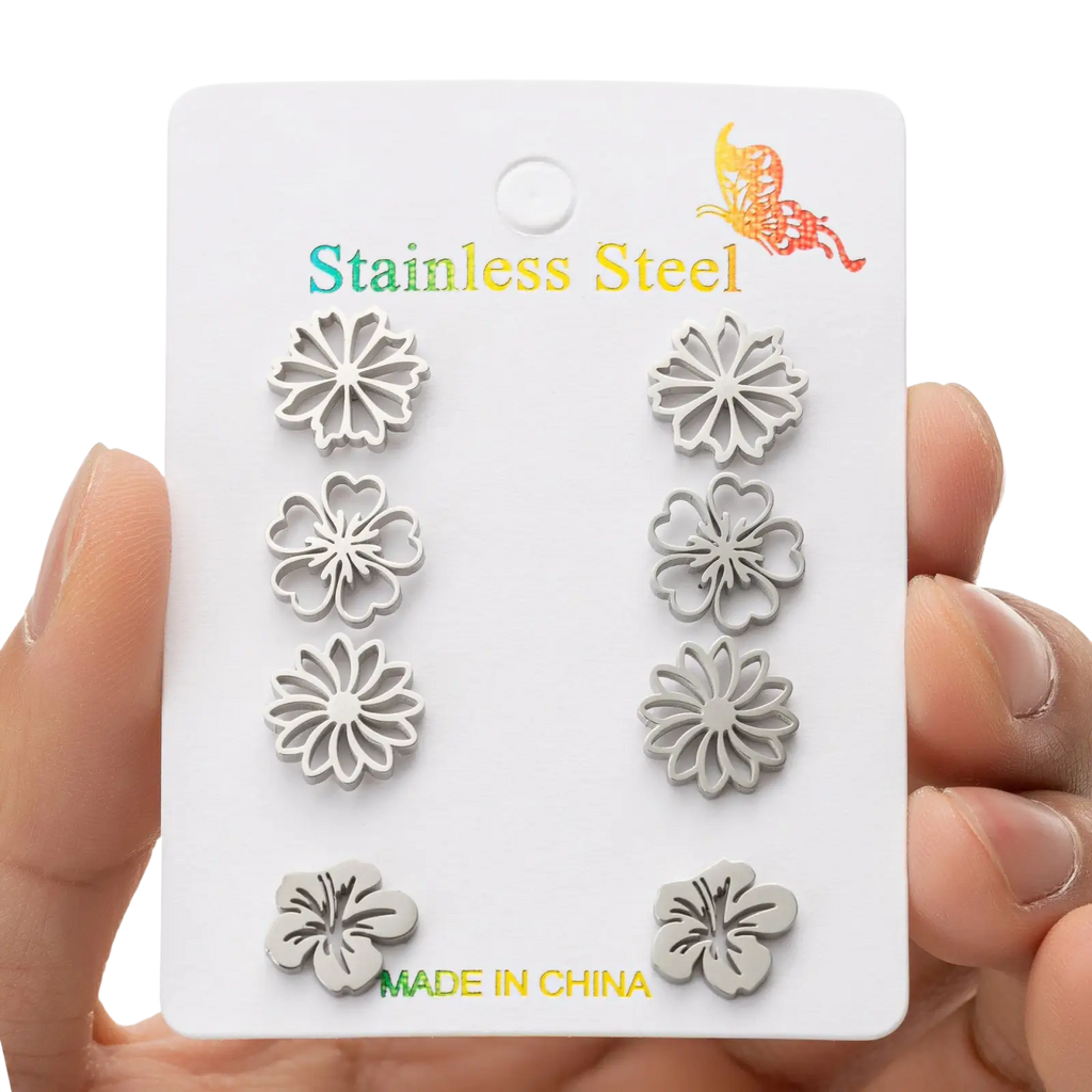 Set of six silver floral stainless steel stud earrings featuring various petal designs for versatile wear