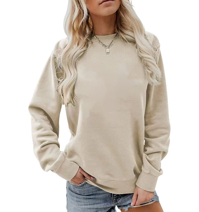 Sudadera tipo crewneck de algodón oversize en color beige, con corte relajado y puños acanalados.