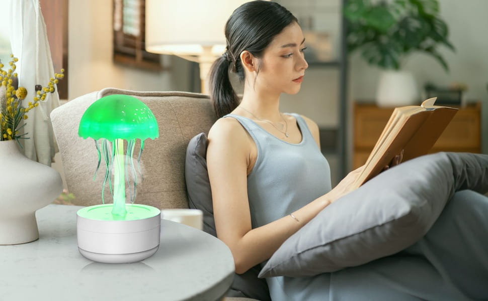 Green jellyfish-shaped humidifier with white base featuring 7 color LED and essential oil diffuser function.
