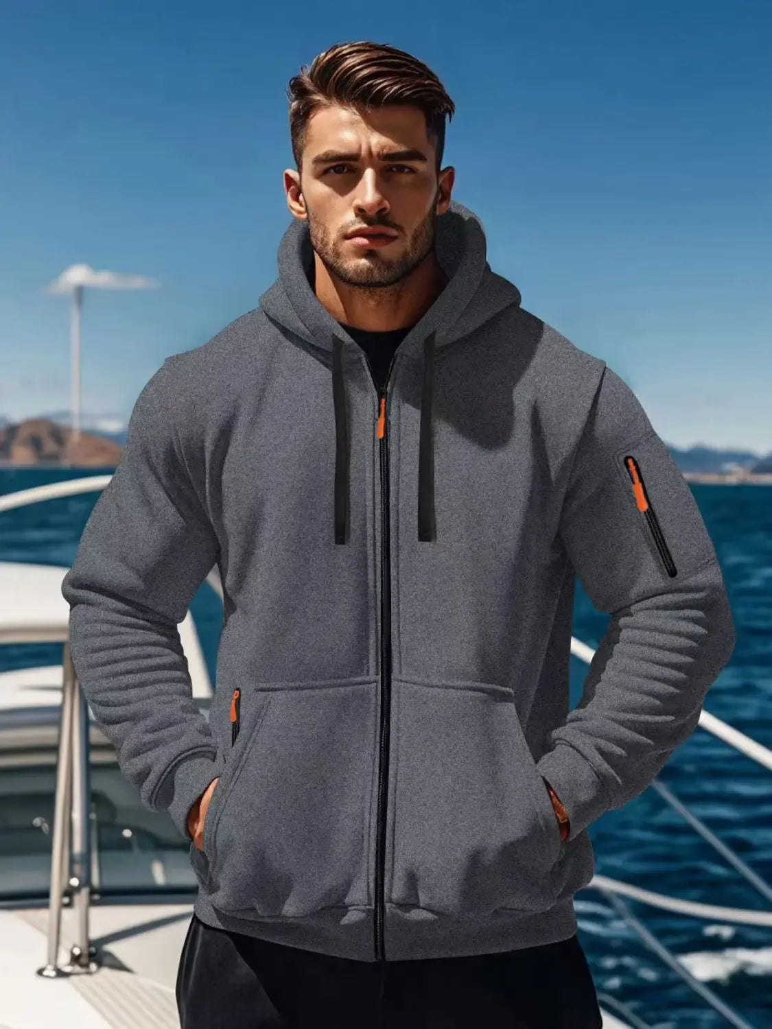 Men’s sport casual fleece lined gray zip-up hoodie jacket with black drawstrings orange zipper pulls ribbed cuffs and front pocket.