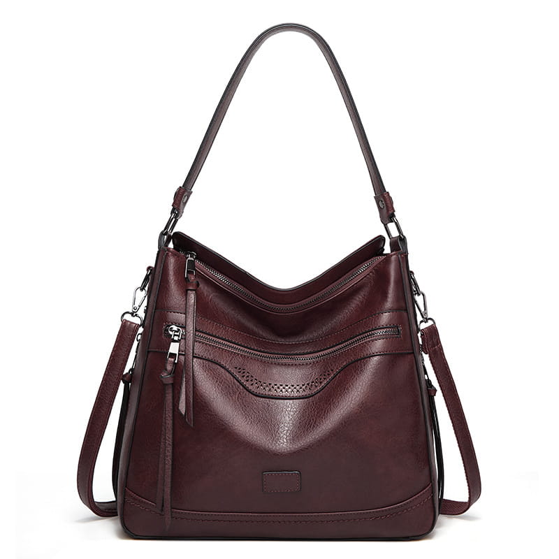 Vintage-Ledertasche im Totebag-Stil, Multi-Pocket-Schultertasche aus burgunderfarbenem Leder, mit einem einzelnen Tragegriff und abnehmbarem Crossbody-Riemen; mit mehreren Reißverschlüssen für eine sichere Aufbewahrung.