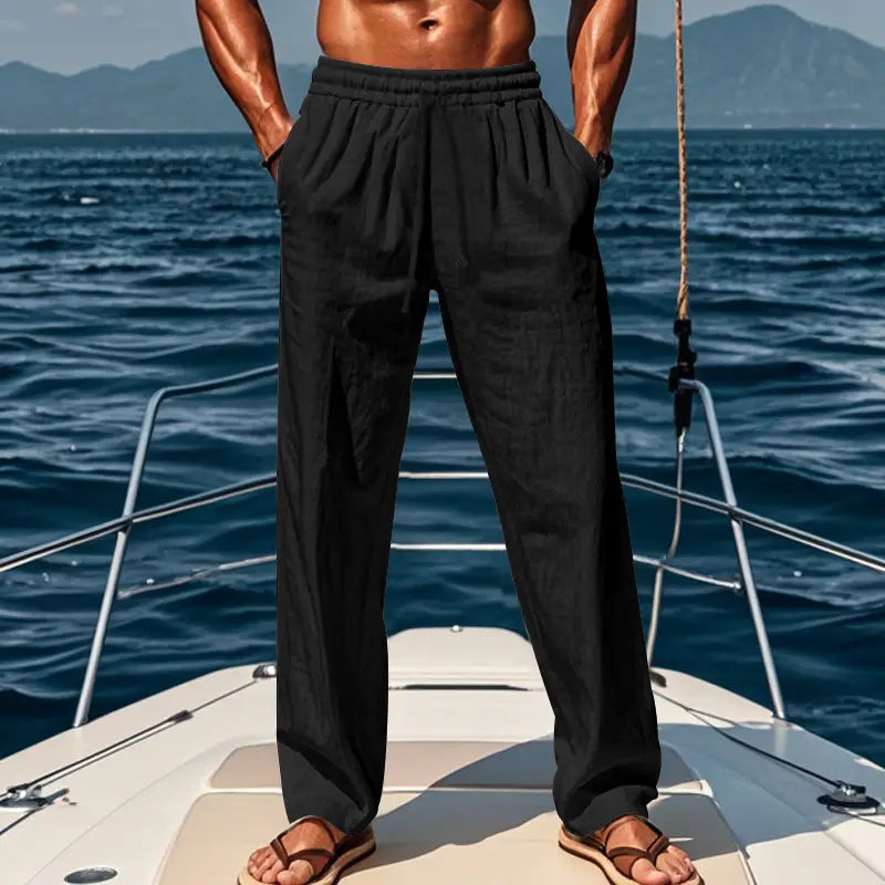men’s black loose-fitting linen joggers with an elastic waistband designed for casual wear.