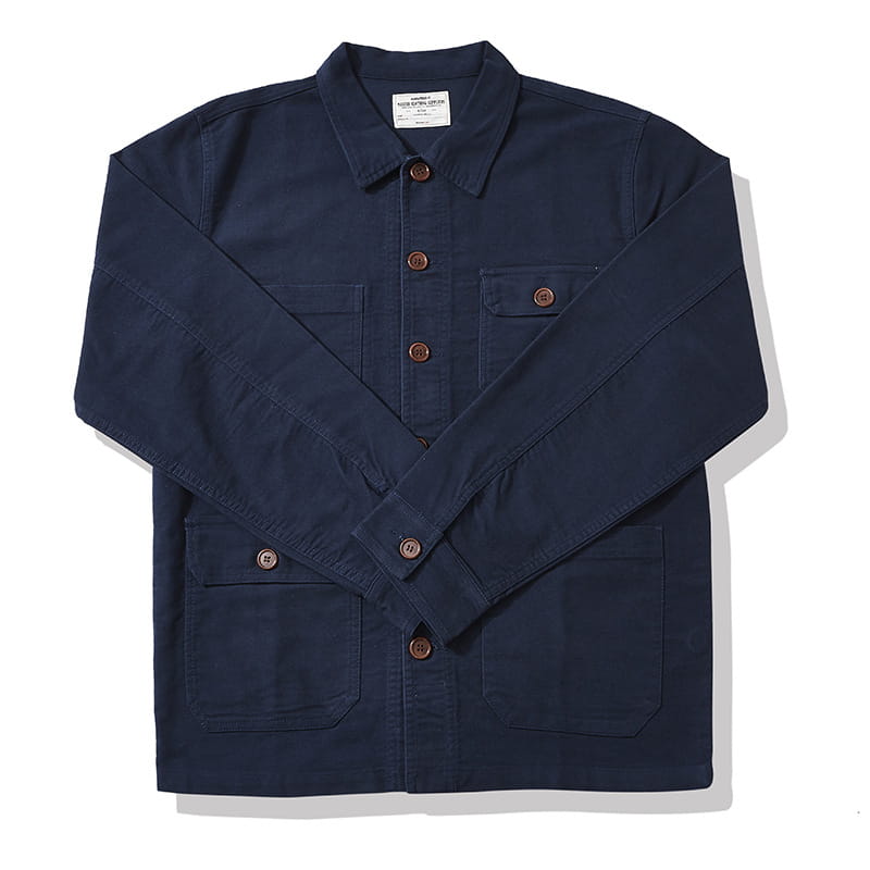 Mens french workwear jacket in navy blue cotton featuring brown buttons and multiple utility pockets.