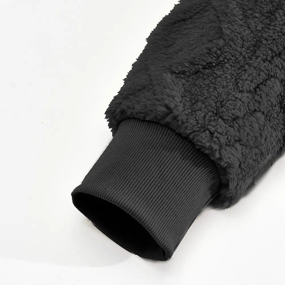 Black fleece lined men’s textured knit hoodie sleeve with ribbed knit cuff in soft fleece material.