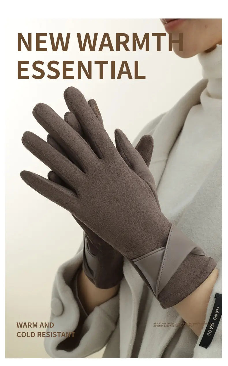 A pair of dark gray touchscreen fleece lined bow gloves with a soft suede-like texture and a sleek wrist strap design shown from the back side.